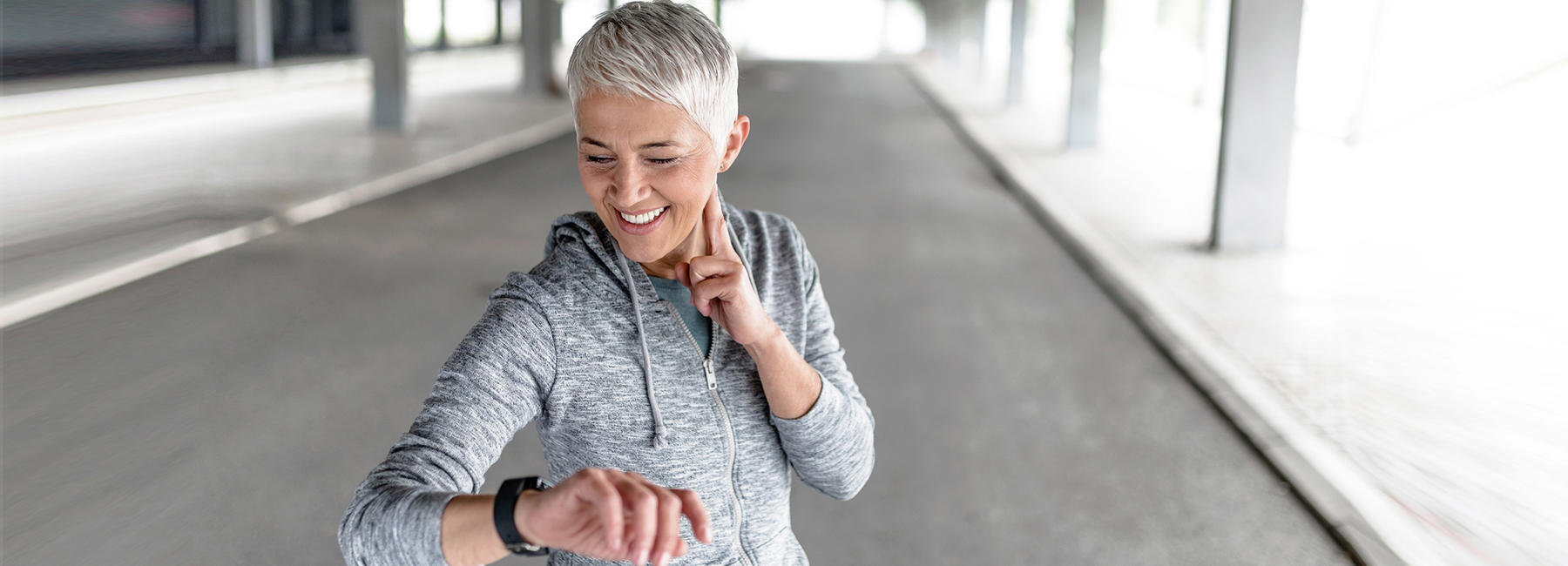 Cardiology testing by Eurofins Clinical Diagnostics Cover image of a woman checking her heart rate.