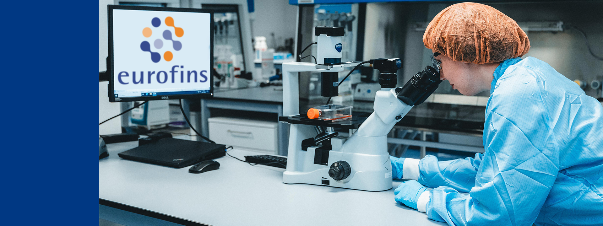 A scientist in a lab illustrating advanced technology used in the production and banking of microbial strains.