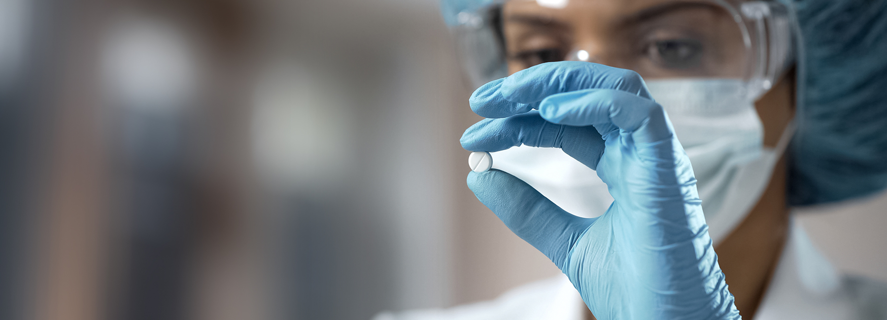 Companion Diagnostics testing by Eurofins Clinical Diagnostics Cover image of a woman holding up a tablet.