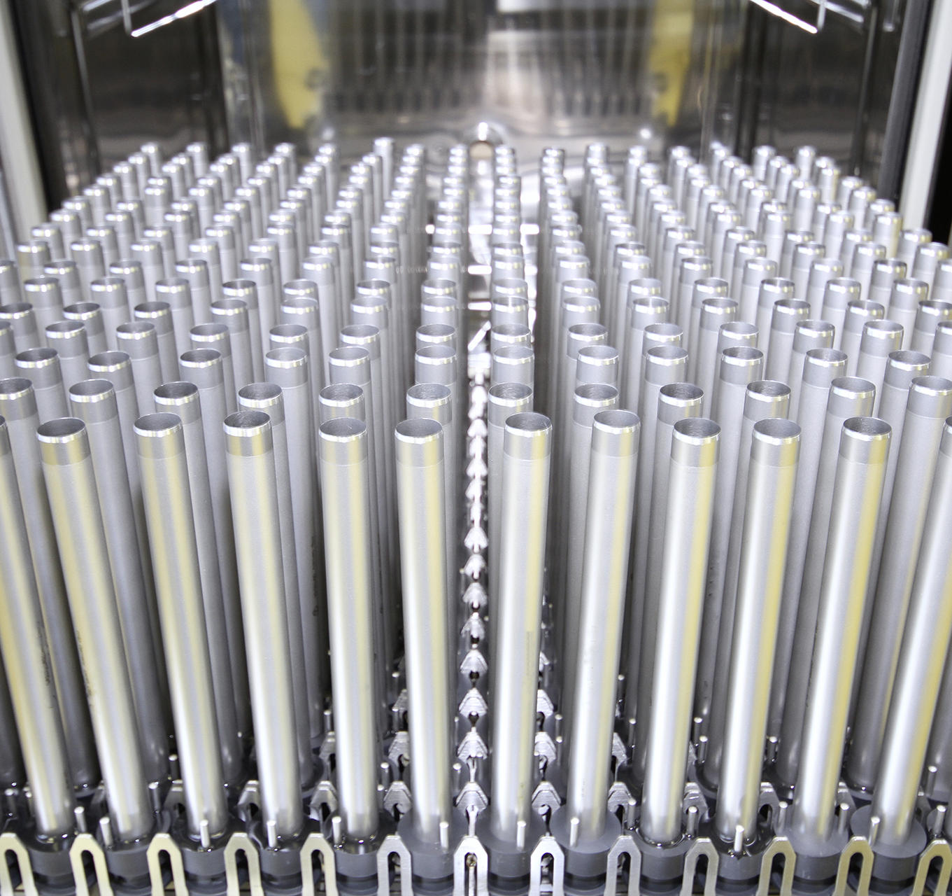 A collection of metallic cylindrical objects arranged in rows within a sterilization or storage unit, likely orthopedic devices. The image is labelled 'Orthopedic Devices'.