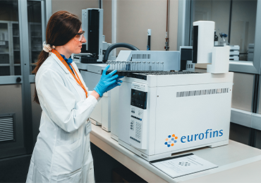 A laboratory analyst at Eurofins BioPharma Product Testing operating advanced analytical equipment for pharmaceutical gas testing, ensuring quality and compliance with regulatory standards.