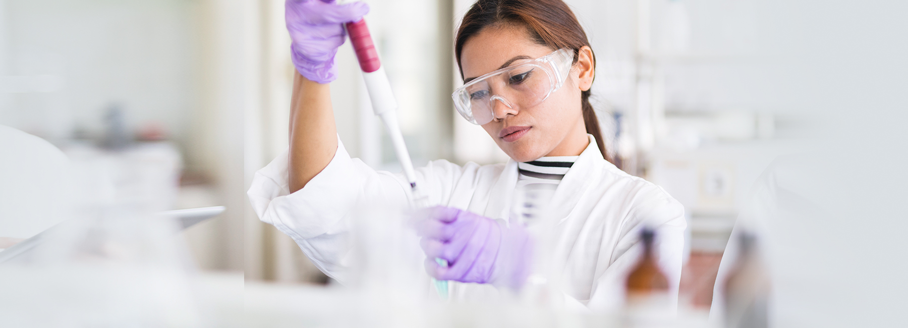 Oncology testing by Eurofins Clinical Diagnostics Cover image of a woman using a pipette.