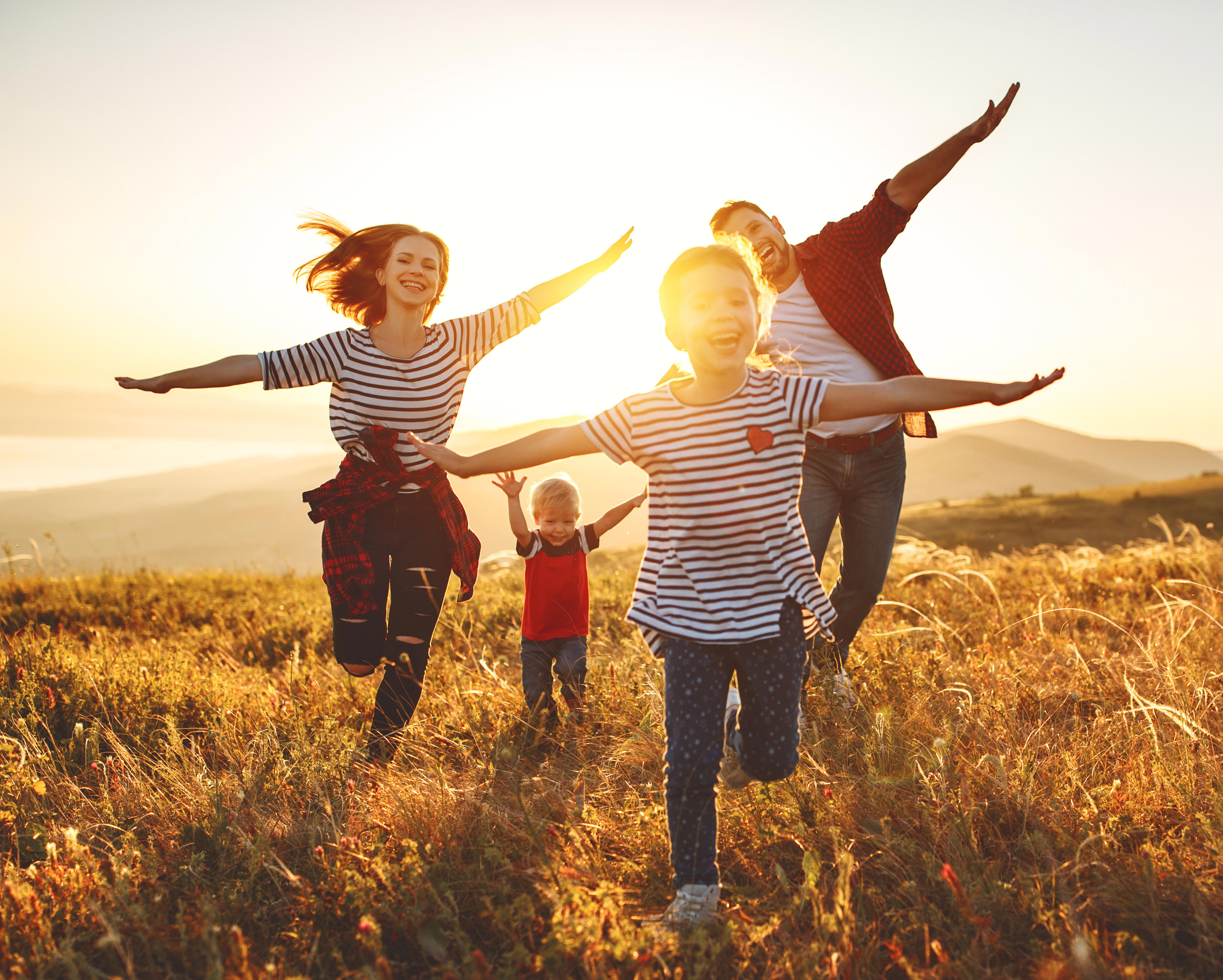 happy-family-mother-father-children-son-and-daughter-on-nature-on-sunset_5914-x-4740-px (1)
