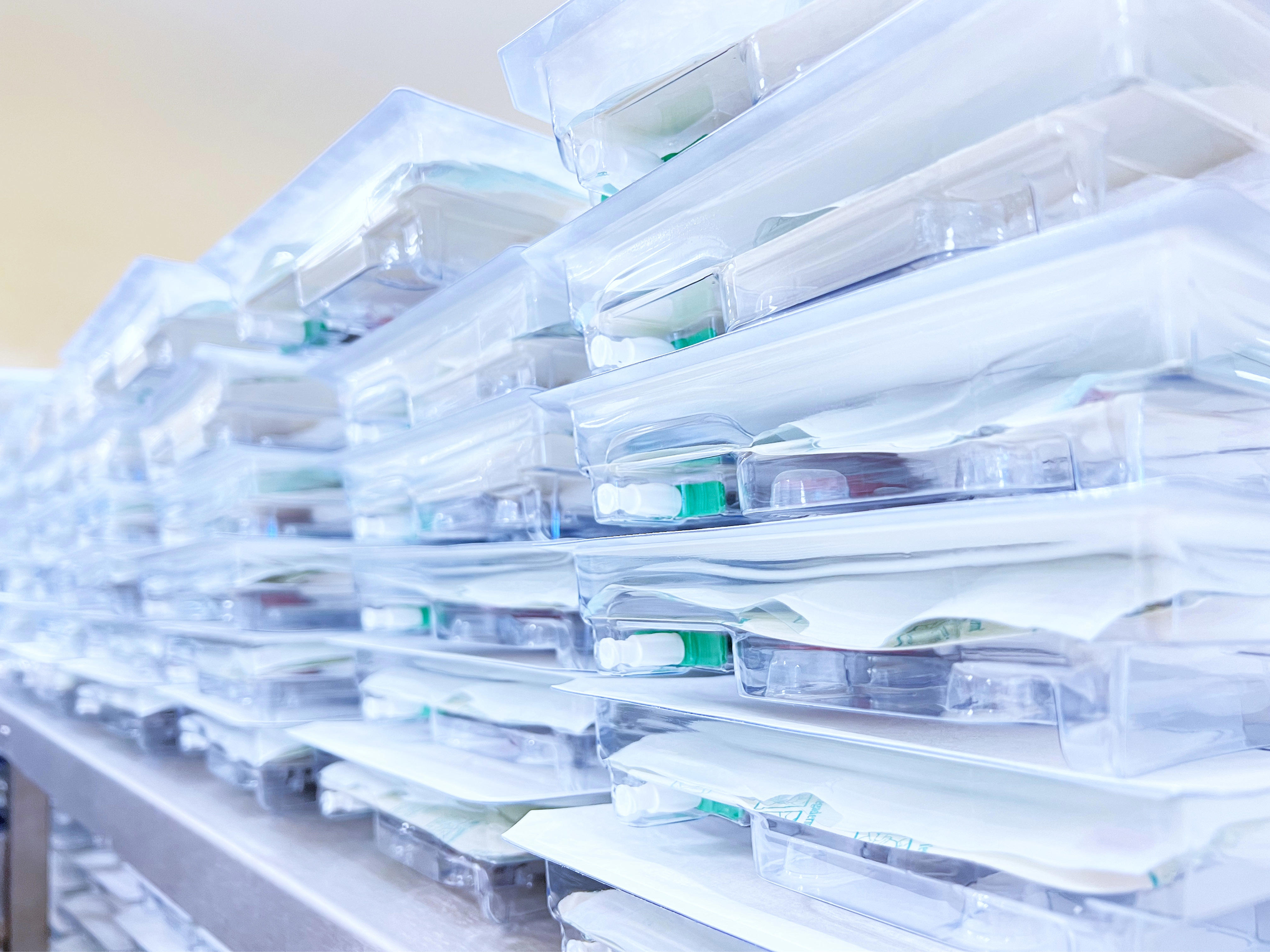 Multiple stacks of transparent plastic containers, each holding various medical supplies, organized neatly. The image is labelled 'Wound Healing'.